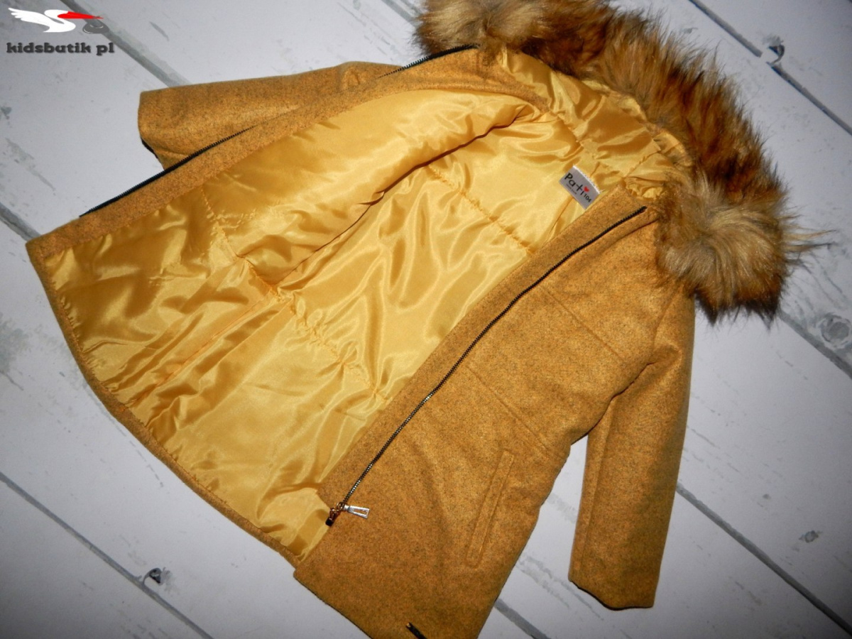 An elegant winter coat with fur An elegant winter coat with fur