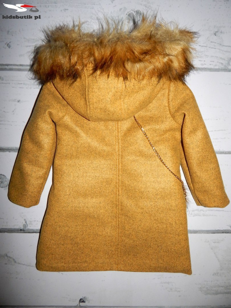 An elegant winter coat with fur An elegant winter coat with fur