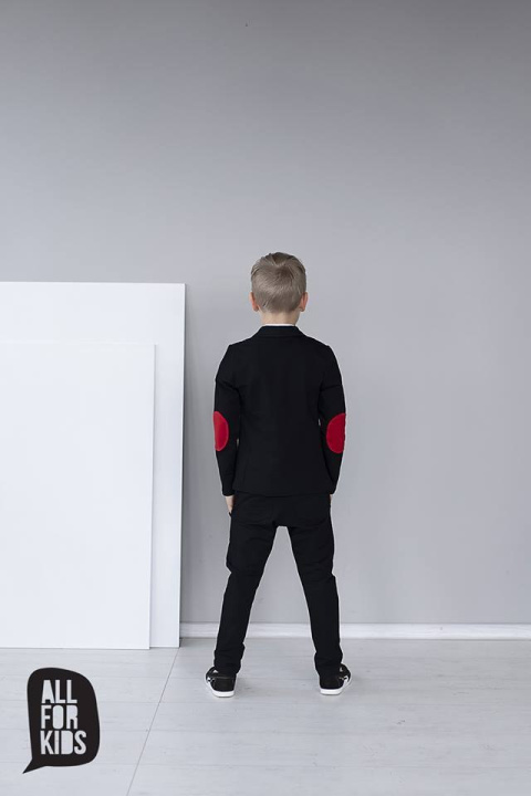 Elegantly sporty black suit with bow tie and red patches Elegantly sporty black suit with bow tie and red patches