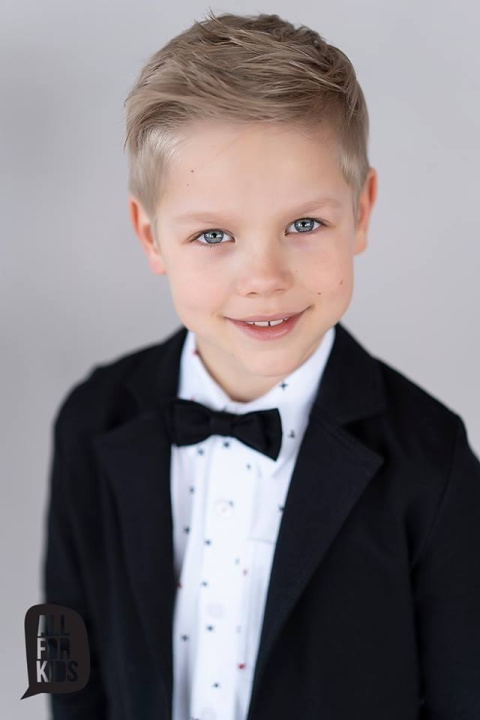 Elegantly sporty black suit with bow tie and red patches Elegantly sporty black suit with bow tie and red patches