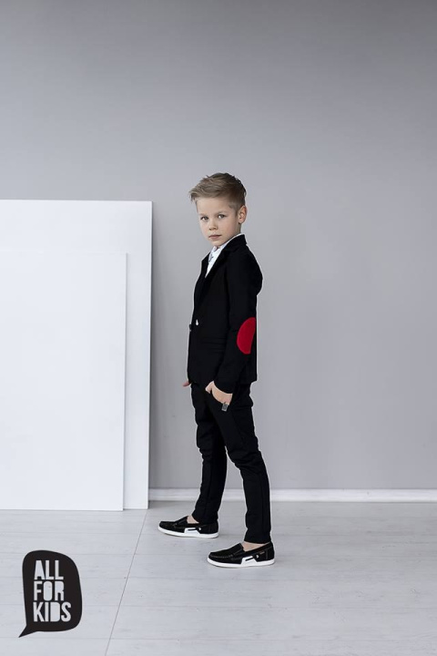 Elegantly sporty black suit with bow tie and red patches Elegantly sporty black suit with bow tie and red patches