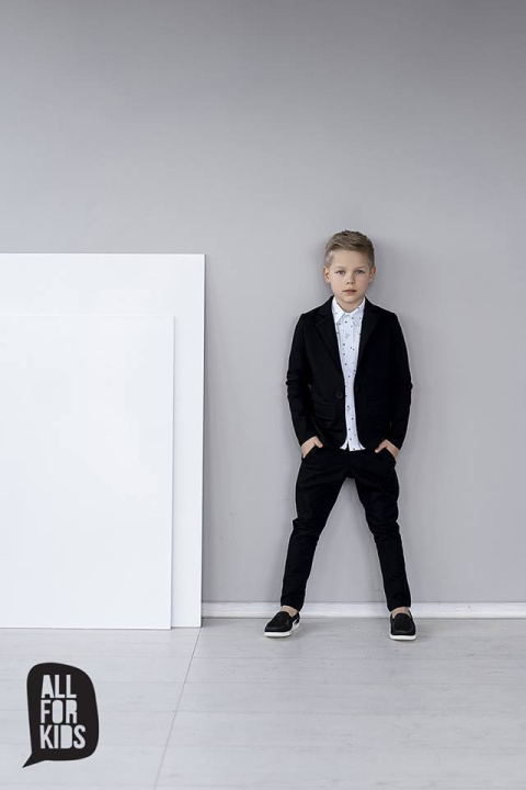 Elegantly sporty black suit with bow tie and red patches Elegantly sporty black suit with bow tie and red patches