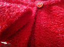 Sweater with a shiny thread and decorative button