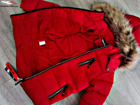 Winter quilted red jacket with fur trim and decorative ziplocks Winter quilted red jacket with fur trim and decorative ziplocks
